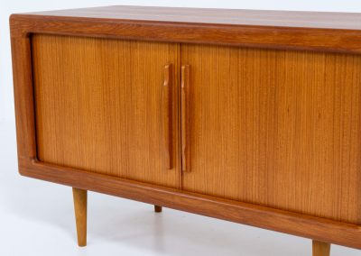 Svend Dyrlund teak sideboard with tambour doors (Denmark, 1960s). A wonderful sideboard with sought after dimensions. It perfectly combines very organic shapes and loads of detail, like the tambour sliding doors and the beautiful handles. It offers lots of storage space with two adjustable shelves on the inside. In splendid condition