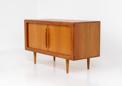 Svend Dyrlund teak sideboard with tambour doors (Denmark, 1960s). A wonderful sideboard with sought after dimensions. It perfectly combines very organic shapes and loads of detail, like the tambour sliding doors and the beautiful handles. It offers lots of storage space with two adjustable shelves on the inside. In splendid condition