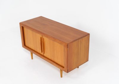 Svend Dyrlund teak sideboard with tambour doors (Denmark, 1960s). A wonderful sideboard with sought after dimensions. It perfectly combines very organic shapes and loads of detail, like the tambour sliding doors and the beautiful handles. It offers lots of storage space with two adjustable shelves on the inside. In splendid condition