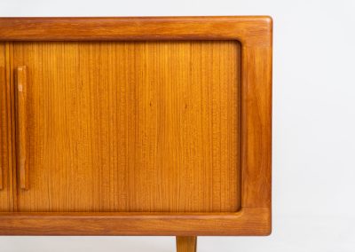 Svend Dyrlund teak sideboard with tambour doors (Denmark, 1960s). A wonderful sideboard with sought after dimensions. It perfectly combines very organic shapes and loads of detail, like the tambour sliding doors and the beautiful handles. It offers lots of storage space with two adjustable shelves on the inside. In splendid condition