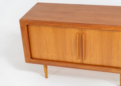 Svend Dyrlund teak sideboard with tambour doors (Denmark, 1960s). A wonderful sideboard with sought after dimensions. It perfectly combines very organic shapes and loads of detail, like the tambour sliding doors and the beautiful handles. It offers lots of storage space with two adjustable shelves on the inside. In splendid condition