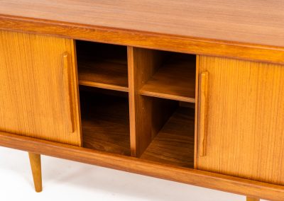 Svend Dyrlund teak sideboard with tambour doors (Denmark, 1960s). A wonderful sideboard with sought after dimensions. It perfectly combines very organic shapes and loads of detail, like the tambour sliding doors and the beautiful handles. It offers lots of storage space with two adjustable shelves on the inside. In splendid condition