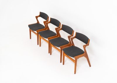 Set of 4 dining chairs by Nova Møbler (Denmark, 1960s). A very unique chair, made of solid teak frames and seats newly upholstered in a dark grey fabric. They are in very good condition and labeled by maker.