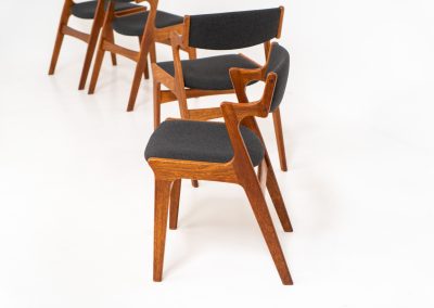 Set of 4 dining chairs by Nova Møbler (Denmark, 1960s). A very unique chair, made of solid teak frames and seats newly upholstered in a dark grey fabric. They are in very good condition and labeled by maker.