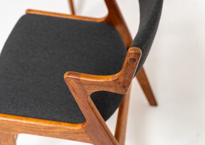 Set of 4 dining chairs by Nova Møbler (Denmark, 1960s). A very unique chair, made of solid teak frames and seats newly upholstered in a dark grey fabric. They are in very good condition and labeled by maker.