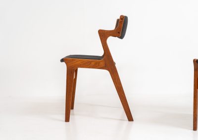 Set of 4 dining chairs by Nova Møbler (Denmark, 1960s). A very unique chair, made of solid teak frames and seats newly upholstered in a dark grey fabric. They are in very good condition and labeled by maker.