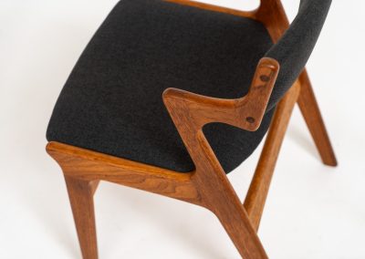 Set of 4 dining chairs by Nova Møbler (Denmark, 1960s). A very unique chair, made of solid teak frames and seats newly upholstered in a dark grey fabric. They are in very good condition and labeled by maker.