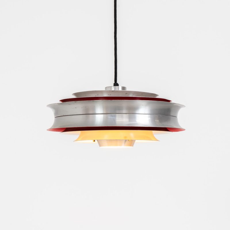 “Trava” pentant light by Carl Thore for Granhaga (Sweden - 1960s). It is made out of aluminum shades with a nice patina.The shades are laquered in a deep red on the inside which gives it a beautiful multicolored and diffused light dispersion. It clearly has some visible traces of age and use, but is overall in very nice vintage condition.