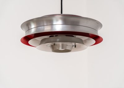 “Trava” pentant light by Carl Thore for Granhaga (Sweden - 1960s). It is made out of aluminum shades with a nice patina.The shades are laquered in a deep red on the inside which gives it a beautiful multicolored and diffused light dispersion. It clearly has some visible traces of age and use, but is overall in very nice vintage condition.