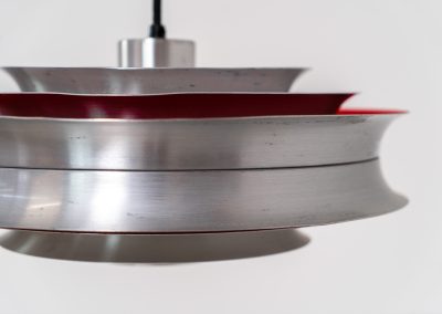 “Trava” pentant light by Carl Thore for Granhaga (Sweden - 1960s). It is made out of aluminum shades with a nice patina.The shades are laquered in a deep red on the inside which gives it a beautiful multicolored and diffused light dispersion. It clearly has some visible traces of age and use, but is overall in very nice vintage condition.