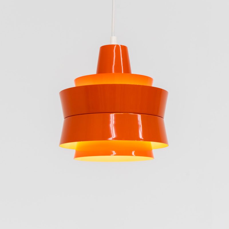 Colorful “Trava” pentant light by Carl Thore for Granhaga (Sweden, 1960s). A beautiful little lamp made out of aluminum shades lacquered in orange. The lamp features its original lacquer and is in splendid condition. It is newly rewired.