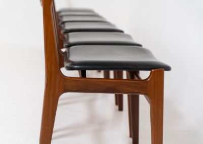 Set of 6 beautiful dining chairs attributed to Erik Buch (Denmark, 1960s). They feature organically curved solid teak frames and floating seats, newly upholstered in a black skai leather. These beauties are in excellent condition.