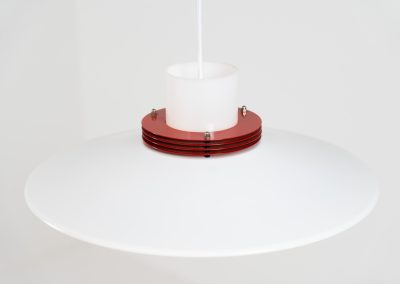 Remarkable pendant light by Lyfa (Denmark, 1970s). A beatiful piece made with a opal glass cone that goes from top to bottom and a white lacquered aluminium shade, finished with some red details. This lamp presents itself in amazingly good condition. It is newly rewired aswell.