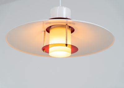 Remarkable pendant light by Lyfa (Denmark, 1970s). A beatiful piece made with a opal glass cone that goes from top to bottom and a white lacquered aluminium shade, finished with some red details. This lamp presents itself in amazingly good condition. It is newly rewired aswell.