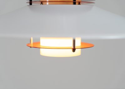 Remarkable pendant light by Lyfa (Denmark, 1970s). A beatiful piece made with a opal glass cone that goes from top to bottom and a white lacquered aluminium shade, finished with some red details. This lamp presents itself in amazingly good condition. It is newly rewired aswell.