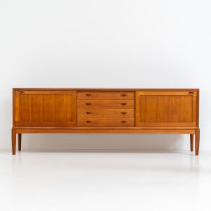 Exceptional sideboard by Henry W. Klein for Bramin (Denmark, 1960s). This is truly a masterpiece! Crafted with high-quality materials and stunning attention to detail, it offers the perfect blend of aesthetics and functionality. This piece features two big sliding doors with adjustable shelves inside, allong with four drawers. The sideboard is in excellent condition!