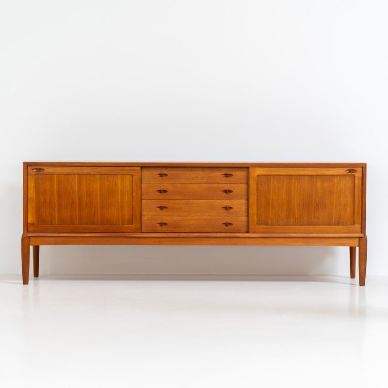 Exceptional sideboard by Henry W. Klein for Bramin (Denmark, 1960s). This is truly a masterpiece! Crafted with high-quality materials and stunning attention to detail, it offers the perfect blend of aesthetics and functionality. This piece features two big sliding doors with adjustable shelves inside, allong with four drawers. The sideboard is in excellent condition!