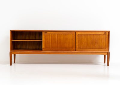 Exceptional sideboard by Henry W. Klein for Bramin (Denmark, 1960s). This is truly a masterpiece! Crafted with high-quality materials and stunning attention to detail, it offers the perfect blend of aesthetics and functionality. This piece features two big sliding doors with adjustable shelves inside, allong with four drawers. The sideboard is in excellent condition!