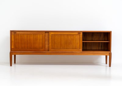 Exceptional sideboard by Henry W. Klein for Bramin (Denmark, 1960s). This is truly a masterpiece! Crafted with high-quality materials and stunning attention to detail, it offers the perfect blend of aesthetics and functionality. This piece features two big sliding doors with adjustable shelves inside, allong with four drawers. The sideboard is in excellent condition!
