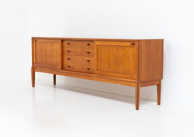 Exceptional sideboard by Henry W. Klein for Bramin (Denmark, 1960s). This is truly a masterpiece! Crafted with high-quality materials and stunning attention to detail, it offers the perfect blend of aesthetics and functionality. This piece features two big sliding doors with adjustable shelves inside, allong with four drawers. The sideboard is in excellent condition!