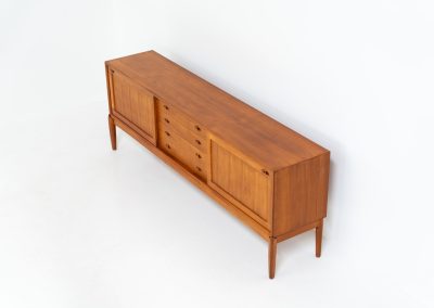 Exceptional sideboard by Henry W. Klein for Bramin (Denmark, 1960s). This is truly a masterpiece! Crafted with high-quality materials and stunning attention to detail, it offers the perfect blend of aesthetics and functionality. This piece features two big sliding doors with adjustable shelves inside, allong with four drawers. The sideboard is in excellent condition!