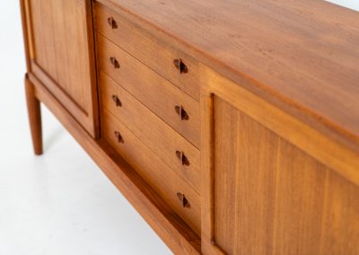 Exceptional sideboard by Henry W. Klein for Bramin (Denmark, 1960s). This is truly a masterpiece! Crafted with high-quality materials and stunning attention to detail, it offers the perfect blend of aesthetics and functionality. This piece features two big sliding doors with adjustable shelves inside, allong with four drawers. The sideboard is in excellent condition!
