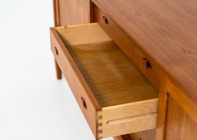 Exceptional sideboard by Henry W. Klein for Bramin (Denmark, 1960s). This is truly a masterpiece! Crafted with high-quality materials and stunning attention to detail, it offers the perfect blend of aesthetics and functionality. This piece features two big sliding doors with adjustable shelves inside, allong with four drawers. The sideboard is in excellent condition!