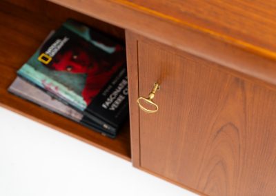 Rare executive writing desk by Ib Kofod Larsen for Faarup (Denmark, 1960s). This huge and absolutely gorgeous piece is one of the highest-quality desks we’ve come across, with an incredible attention to detail! Featuring a spacious desktop with a beautiful woodgrain, two cabinets with locks and an open shelve on the backside, two pull/out leafs and six big drawers on the frontside. Two of the drawers can be securely locked with cleverly hidden locks on the inside. The desk is double sided which makes it a stunning piece to place in the center of a room. This piece presents itself in very good condition. All drawers, doors & locks function very smoothly! It can be easily disassembled for transport or storage.