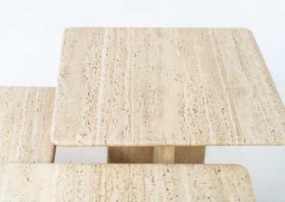 Set of 3 travertine nesting tables (Italy, 1970s). This gorgeous set, crafted in Italy, showcases a beautiful coarse grain that highlights the natural beauty of the stone. This clean and minimalistic design allows for versatile styling, offering endless combinations for various spaces. The tables are in excellent condition, free from cracks, chips or any damage.