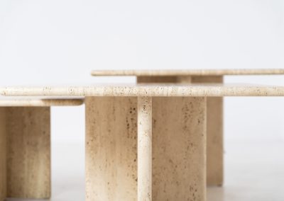Set of 3 travertine nesting tables (Italy, 1970s). This gorgeous set, crafted in Italy, showcases a beautiful coarse grain that highlights the natural beauty of the stone. This clean and minimalistic design allows for versatile styling, offering endless combinations for various spaces. The tables are in excellent condition, free from cracks, chips or any damage.