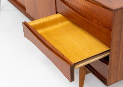 Paola sideboard by Oswald Vermaercke for V-Form (Belgium, 1959). An amazing design with a lot of details and a highly sought after dimensions. Featuring one folding door, two sliding doors and four drawers with beautifully curved bentwood interiors. It’s made out of teak and stands on an oak frame. While it has been restored, it still shows signs of its history, with visible use marks and some veneer patches from repairs. Given its age, it remains in good vintage condition.