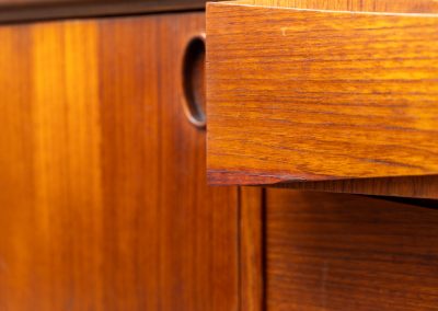 Paola sideboard by Oswald Vermaercke for V-Form (Belgium, 1959). An amazing design with a lot of details and a highly sought after dimensions. Featuring one folding door, two sliding doors and four drawers with beautifully curved bentwood interiors. It’s made out of teak and stands on an oak frame. While it has been restored, it still shows signs of its history, with visible use marks and some veneer patches from repairs. Given its age, it remains in good vintage condition.