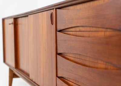 Paola sideboard by Oswald Vermaercke for V-Form (Belgium, 1959). An amazing design with a lot of details and a highly sought after dimensions. Featuring one folding door, two sliding doors and four drawers with beautifully curved bentwood interiors. It’s made out of teak and stands on an oak frame. While it has been restored, it still shows signs of its history, with visible use marks and some veneer patches from repairs. Given its age, it remains in good vintage condition.