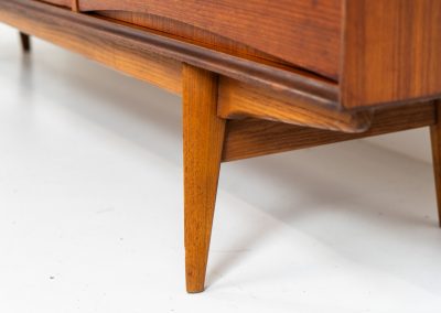 Paola sideboard by Oswald Vermaercke for V-Form (Belgium, 1959). An amazing design with a lot of details and a highly sought after dimensions. Featuring one folding door, two sliding doors and four drawers with beautifully curved bentwood interiors. It’s made out of teak and stands on an oak frame. While it has been restored, it still shows signs of its history, with visible use marks and some veneer patches from repairs. Given its age, it remains in good vintage condition.