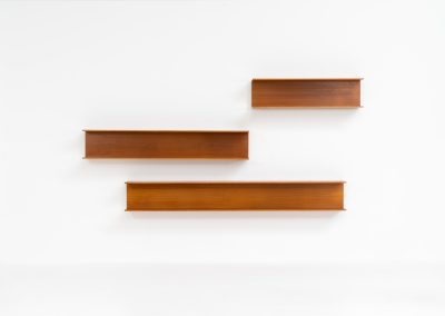 Set of 3 huge wall shelves by Walter Wirz for Wilhelm Renz (Germany, 1965). These iconic U-shaped wall shelves in teak are just stunning. They are sleek, timeless and absolutely beautiful. The shelves remain in very good and original condition. They are labeled.