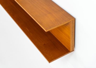 Set of 3 huge wall shelves by Walter Wirz for Wilhelm Renz (Germany, 1965). These iconic U-shaped wall shelves in teak are just stunning. They are sleek, timeless and absolutely beautiful. The shelves remain in very good and original condition. They are labeled.