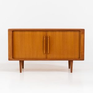 Svend Dyrlund teak sideboard with tambour doors (Denmark, 1960s). A wonderful sideboard with sought after dimensions. It perfectly combines very organic shapes and loads of detail, like the tambour sliding doors and the beautiful handles. It offers lots of storage space with an adjustable shelve and two drawers on the inside. An ideal piece for storing a record player and vinyls. Except for a little color difference on the top, this piece is in mint condition.