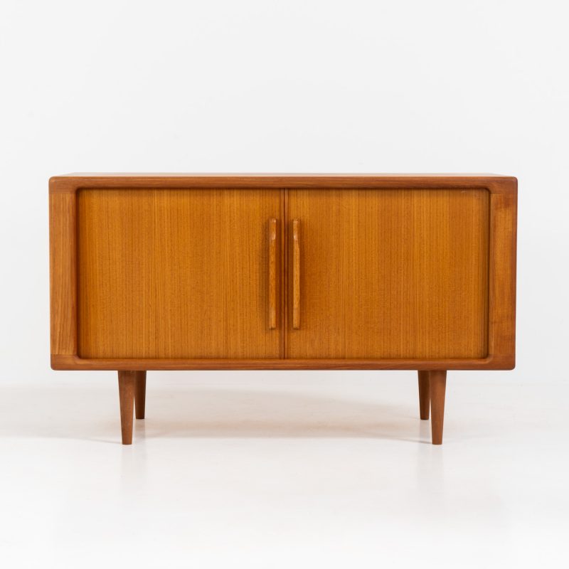 Svend Dyrlund teak sideboard with tambour doors (Denmark, 1960s). A wonderful sideboard with sought after dimensions. It perfectly combines very organic shapes and loads of detail, like the tambour sliding doors and the beautiful handles. It offers lots of storage space with an adjustable shelve and two drawers on the inside. An ideal piece for storing a record player and vinyls. Except for a little color difference on the top, this piece is in mint condition.