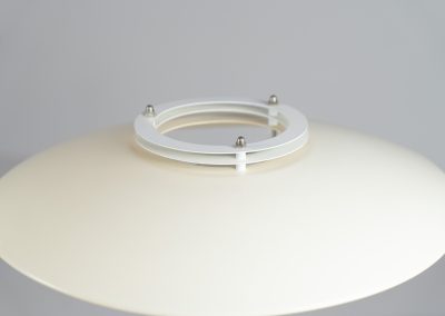 Danish table lamp, 1970s. We don’t know who made this one, but it is clearly inspired by Louis Poulsen’s work. The lamp is easy adjustable in highly with a chrome wheel. It’s made out of white lacquered metal with chrome details. It is in good vintage condition. The shade is not perfectly aligned anymore and the lacquer has some small color differences.