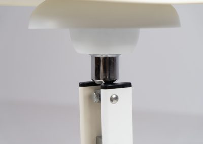 Danish table lamp, 1970s. We don’t know who made this one, but it is clearly inspired by Louis Poulsen’s work. The lamp is easy adjustable in highly with a chrome wheel. It’s made out of white lacquered metal with chrome details. It is in good vintage condition. The shade is not perfectly aligned anymore and the lacquer has some small color differences.