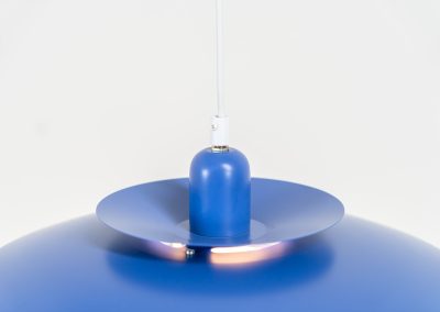 Colorful pendant light by EL-Light (Denmark, 1970s). This striking lamp showcases a minimalist, timeless design from the 1970s. Composed of four aluminum shades, the fixture is lacquered in a vivid, still original, blue color. The lamp is restored, rewired and in remarkably good condition!