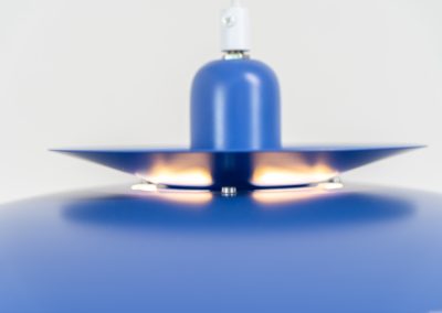 Colorful pendant light by EL-Light (Denmark, 1970s). This striking lamp showcases a minimalist, timeless design from the 1970s. Composed of four aluminum shades, the fixture is lacquered in a vivid, still original, blue color. The lamp is restored, rewired and in remarkably good condition!