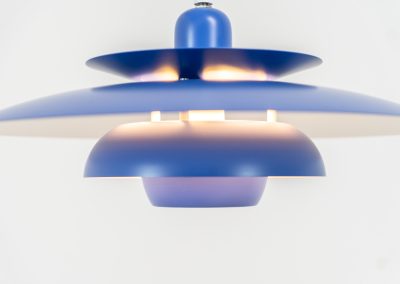 Colorful pendant light by EL-Light (Denmark, 1970s). This striking lamp showcases a minimalist, timeless design from the 1970s. Composed of four aluminum shades, the fixture is lacquered in a vivid, still original, blue color. The lamp is restored, rewired and in remarkably good condition!