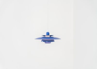 Colorful pendant light by EL-Light (Denmark, 1970s). This striking lamp showcases a minimalist, timeless design from the 1970s. Composed of four aluminum shades, the fixture is lacquered in a vivid, still original, blue color. The lamp is restored, rewired and in remarkably good condition!