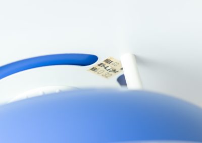 Colorful pendant light by EL-Light (Denmark, 1970s). This striking lamp showcases a minimalist, timeless design from the 1970s. Composed of four aluminum shades, the fixture is lacquered in a vivid, still original, blue color. The lamp is restored, rewired and in remarkably good condition!