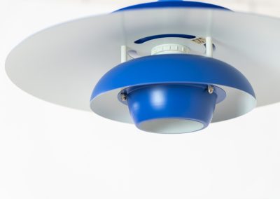 Colorful pendant light by EL-Light (Denmark, 1970s). This striking lamp showcases a minimalist, timeless design from the 1970s. Composed of four aluminum shades, the fixture is lacquered in a vivid, still original, blue color. The lamp is restored, rewired and in remarkably good condition!