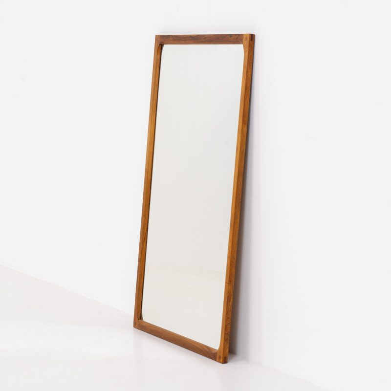 Stunning “No.166” wall mirror in rosewood by Kai Kristiansen for Aksel Kjersgaard (Denmark, 1960s). A beautifully crafted piece made by Denmark’s most renowned mirror makers, Aksel Kjersgaard. The frame, made out of solid Santos rosewood, has a warm and mesmerizing woodgrain and very nice details. In very good condition. Marked by maker.