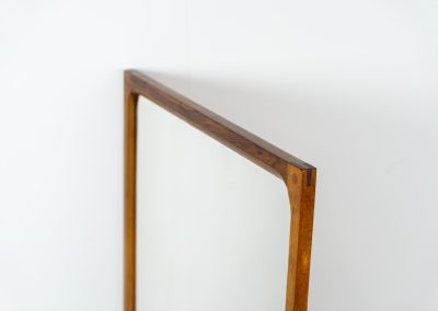Stunning “No.166” wall mirror in rosewood by Kai Kristiansen for Aksel Kjersgaard (Denmark, 1960s). A beautifully crafted piece made by Denmark’s most renowned mirror makers, Aksel Kjersgaard. The frame, made out of solid Santos rosewood, has a warm and mesmerizing woodgrain and very nice details. In very good condition. Marked by maker.