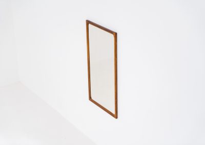 Stunning “No.166” wall mirror in rosewood by Kai Kristiansen for Aksel Kjersgaard (Denmark, 1960s). A beautifully crafted piece made by Denmark’s most renowned mirror makers, Aksel Kjersgaard. The frame, made out of solid Santos rosewood, has a warm and mesmerizing woodgrain and very nice details. In very good condition. Marked by maker.