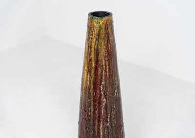 XL “Fat Lava” ceramic floor vase (Germany, 1960s). This impressive multicolored vase features beautiful textures and vibrant colors, finished with a glossy glaze that enhances its unique surface. The vase is in very good condition.
